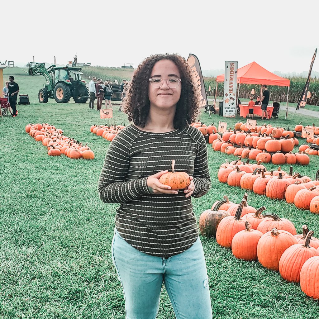 Holding pumpkin at sinkland farms 