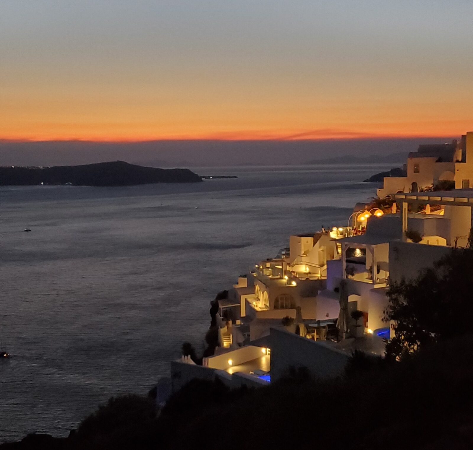 nighttime cliffside view in santorini greece