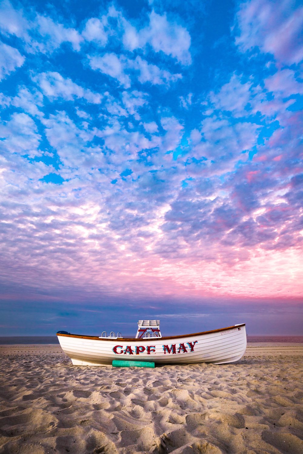 a boat on the sand with cape may weekend getaway nj