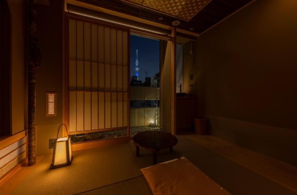 traditional japanese ryokan with a night view of tokyo skytree