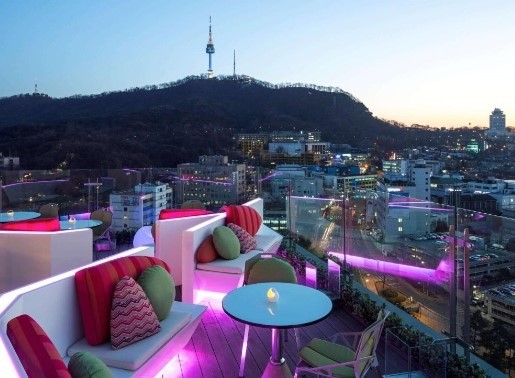 ibis myeongdong hotel rooftop seating area with seoul tower