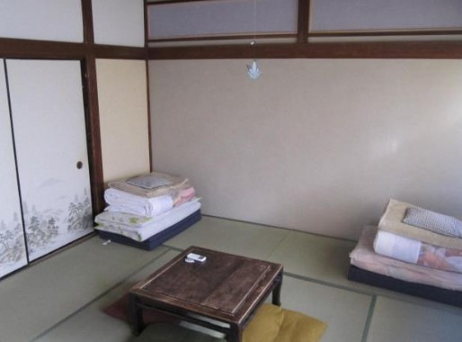 folded up sheets and bedding inside traditional japanese ryokan