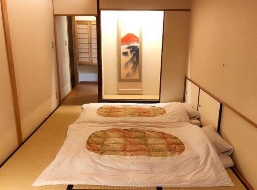 the edo sakura room with beds on floor and artwork