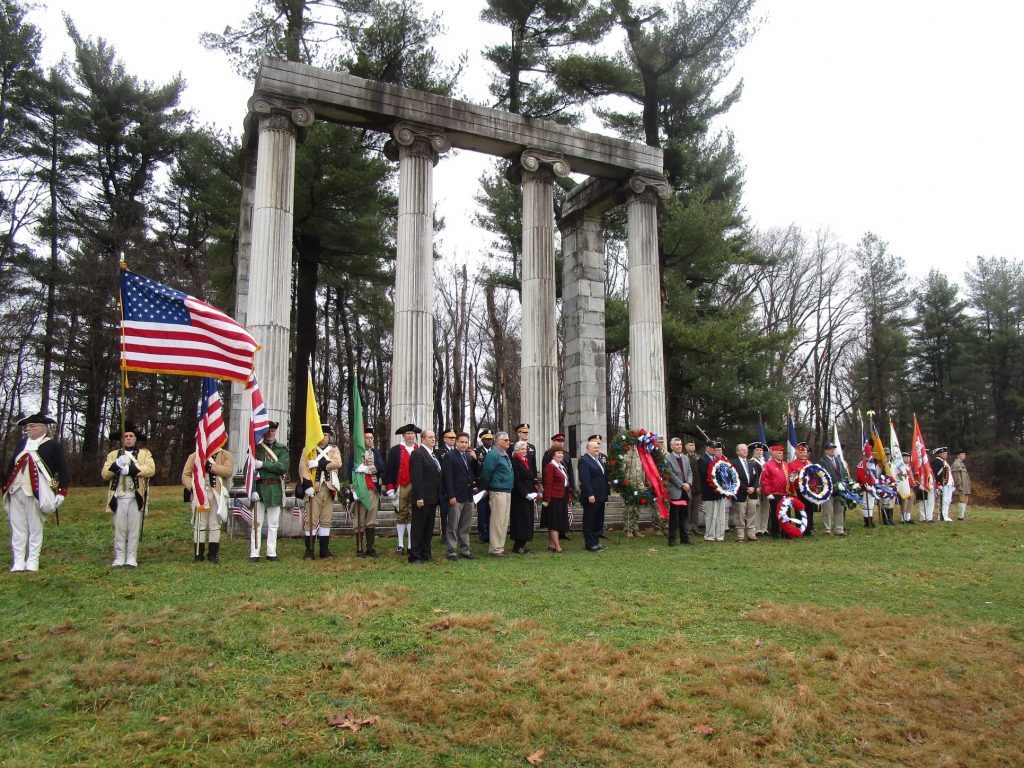 princeton battlefield park with giant columns and people dressed up in colonial costumes