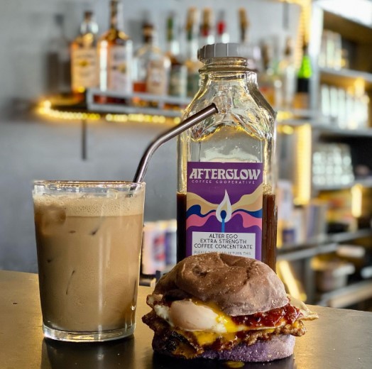 glass of iced coffee from afterglow with a cobra burger