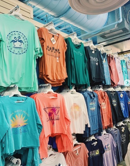 colorful shirts with tropical designs inside gift shop