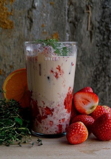 strawberry milk tea with dark background at onion cafe in seoul