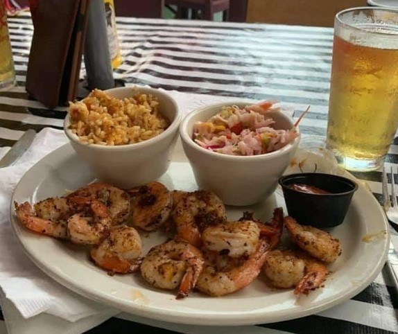 crispy shrimp and rice on a plate with tea