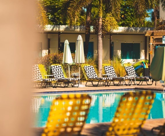yellow lounge chairs by pool