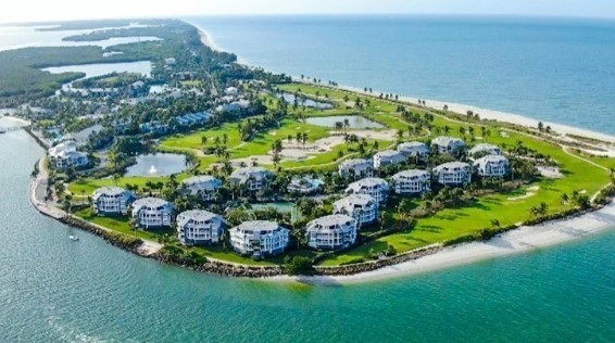 a line of villas on an island in florida with green grass