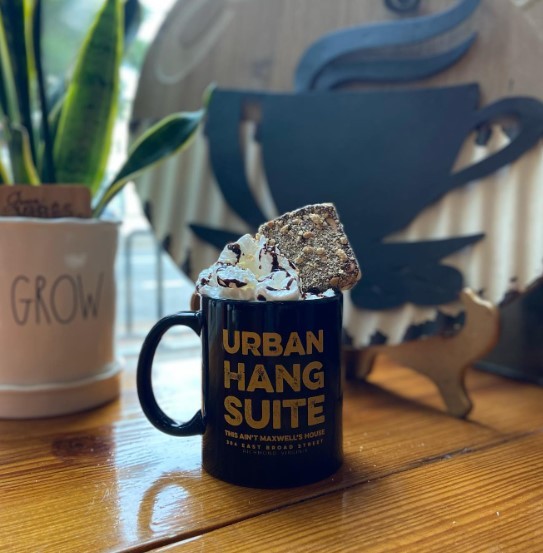 s'mores latte in a blue urban hang suite mug with a plant