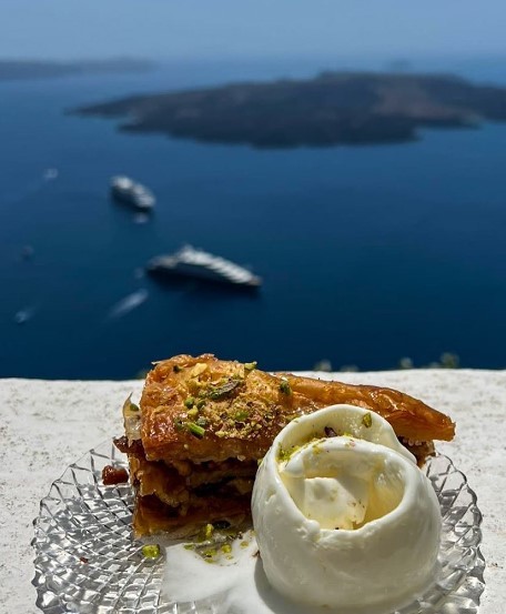 fried seafood dish with a view of the Aegan sea in santorini greece