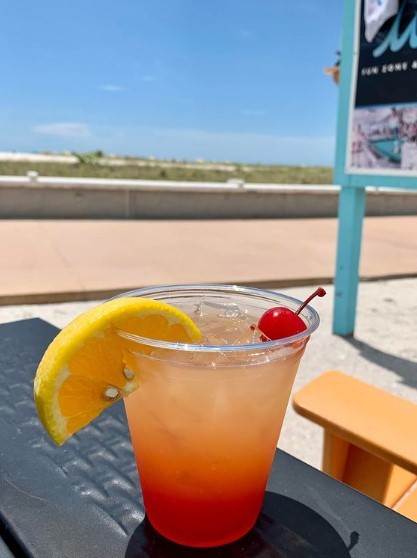 red rum on table outside at waves beach bar in treasure island at the bilmar beach resort