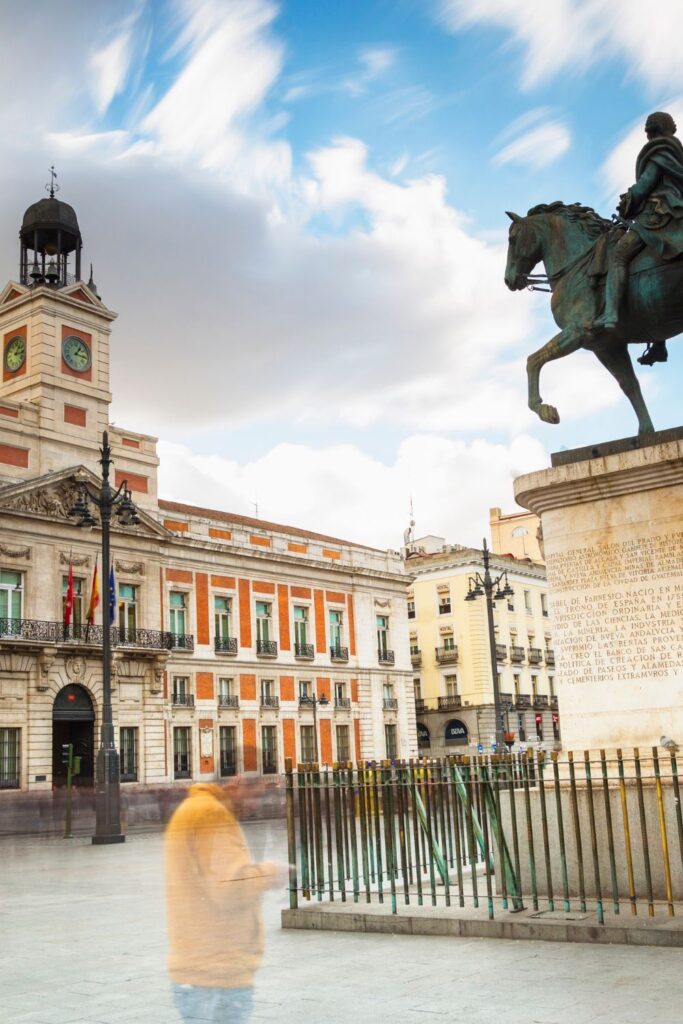 Puerta del Sol with a statue of a man on a horse