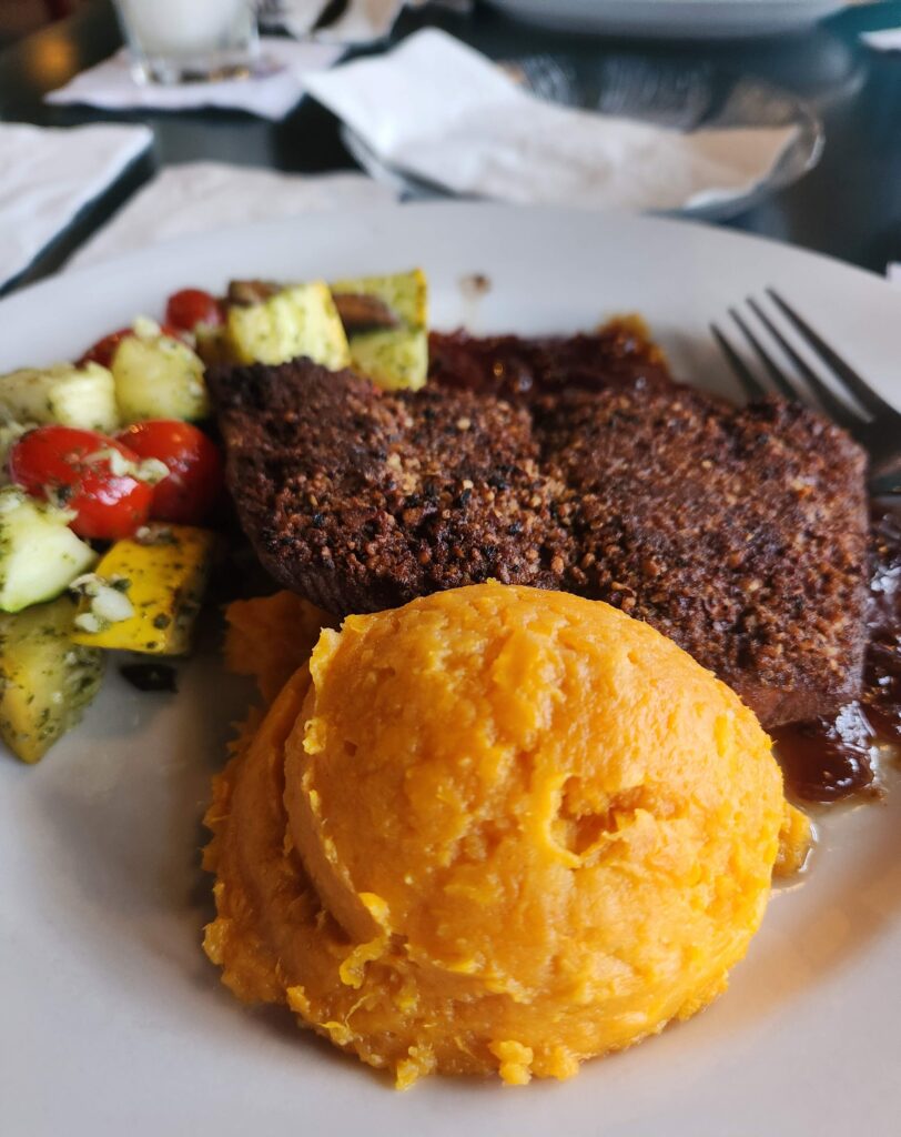pecan crusted fish with sweet potato and veggies at black pelican