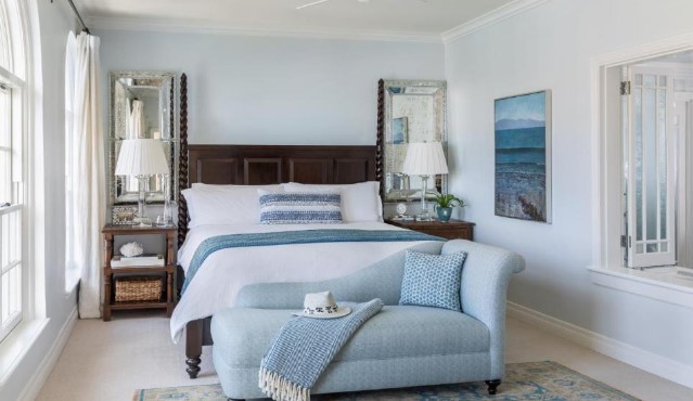 white and blue colored room with large bed and sofa inside santa monica boutique hotel